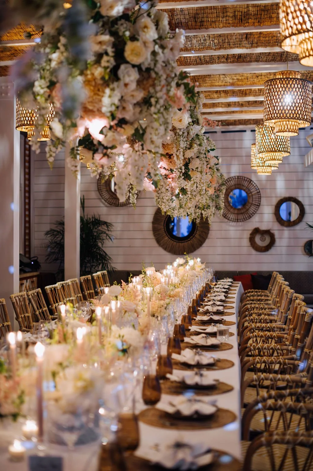 Luxury wedding dinner setup with floral ceiling decor and golden accents for an elegant celebration in St Barth.