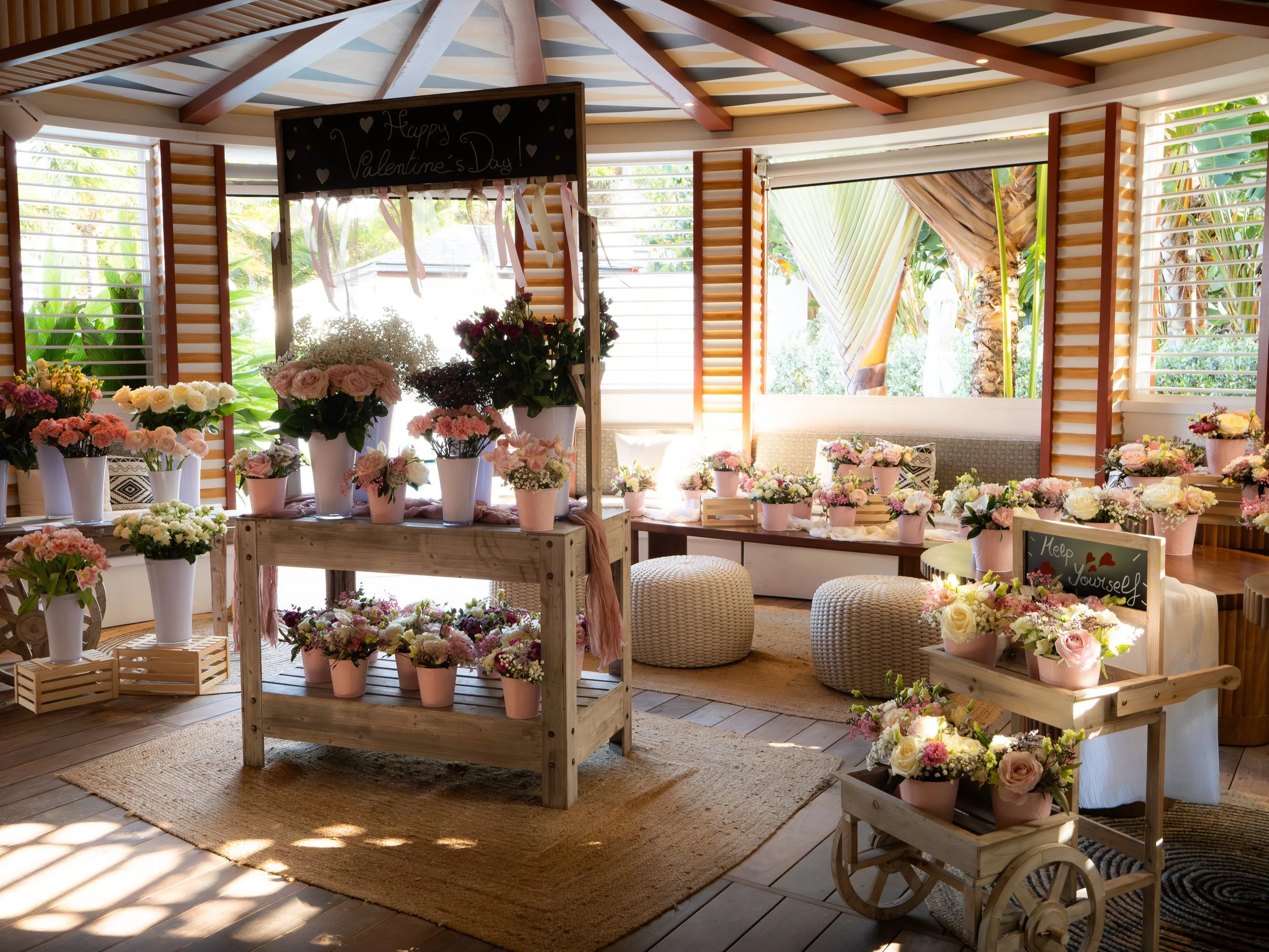 Indoor wedding lounge area decorated with potted plants, soft lighting, and natural materials creating a cozy tropical vibe in St Barth.