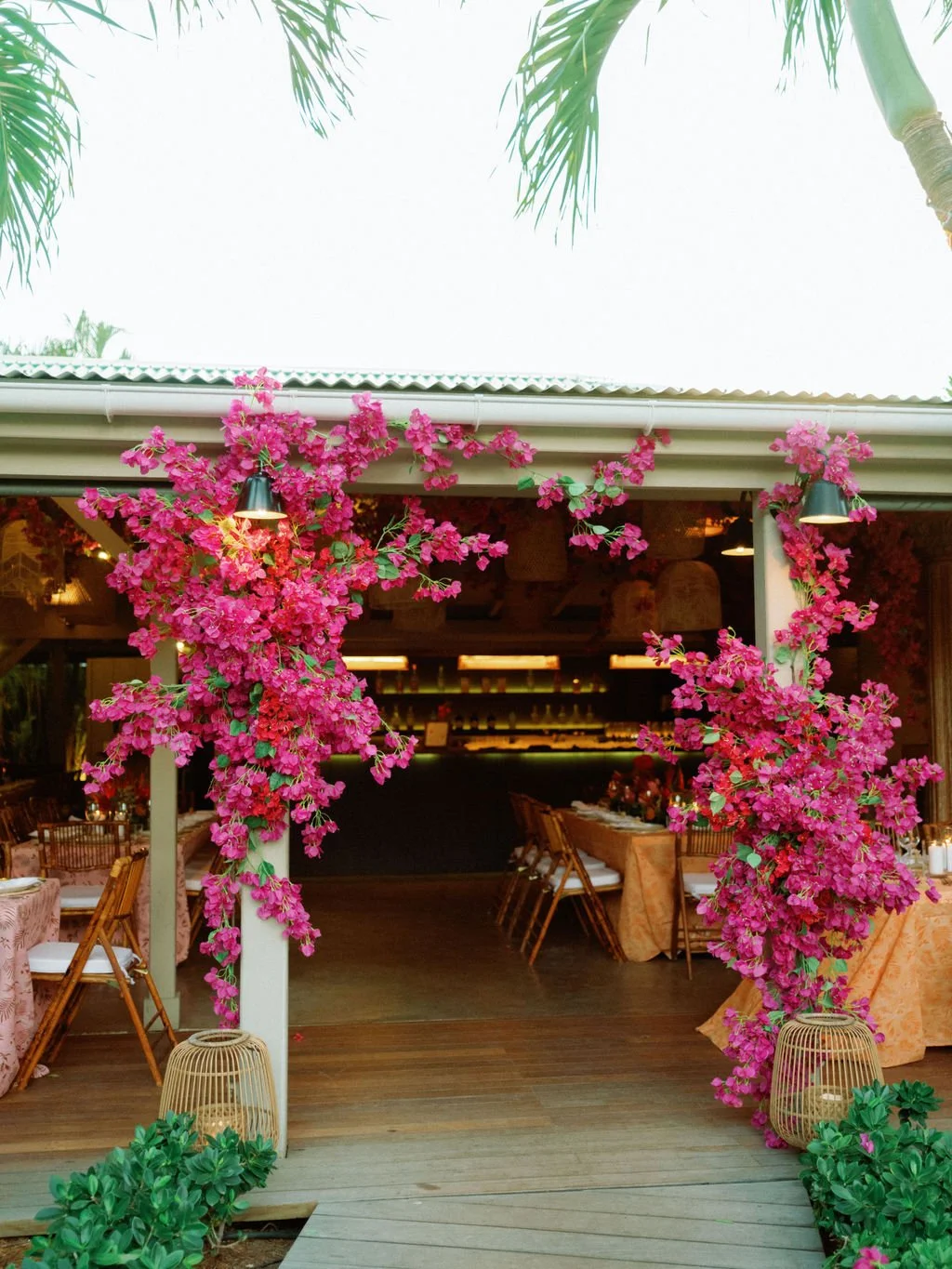 Wedding entrance decorated with fuchsia bougainvillea flowers for a vibrant tropical event in St Barth.