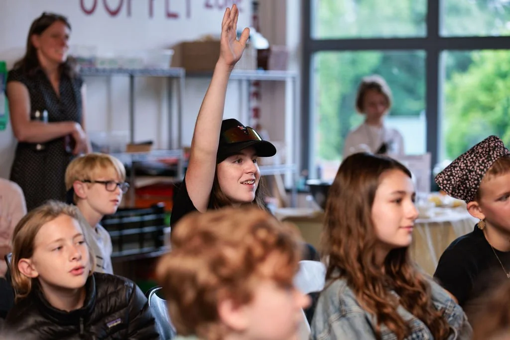 engaged middle school students participating in a conversation