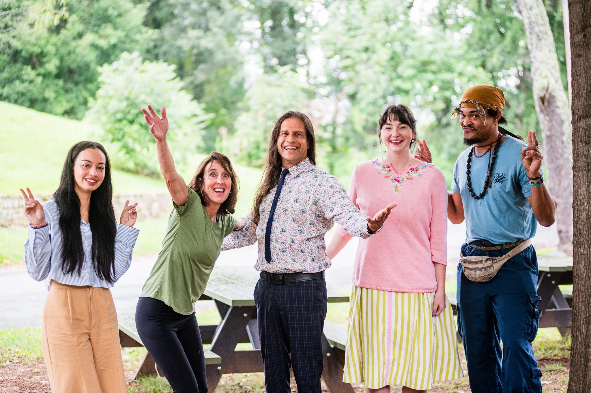 teachers for music, art, physical education, and materiality doing a silly pose