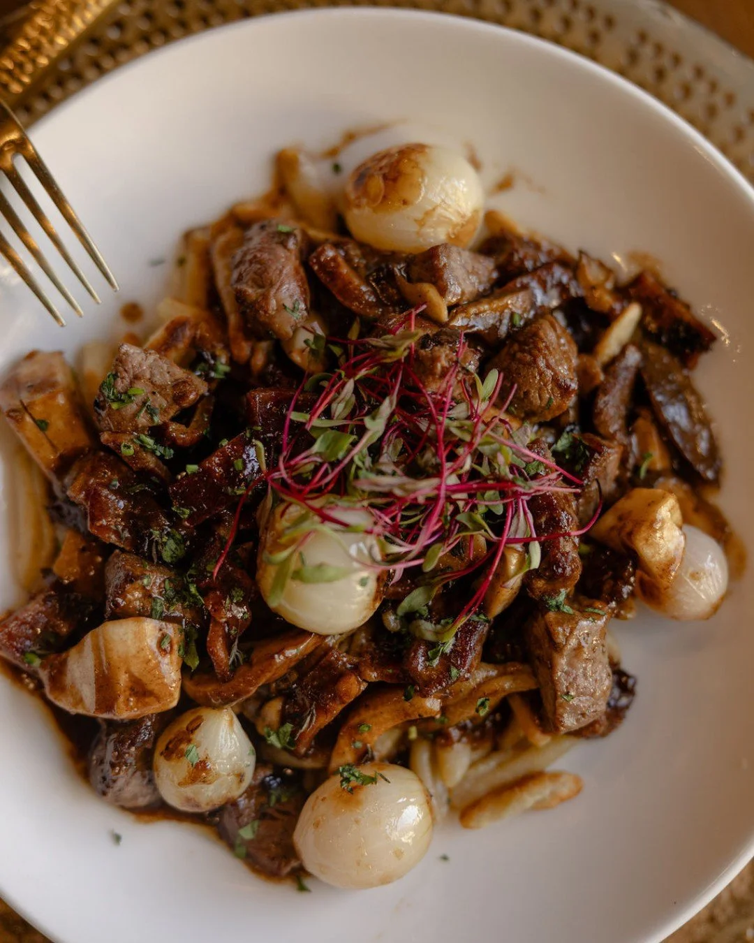 Beef Bourguignon is the &ldquo;cancel your other plans and stay awhile&rdquo; order. She's cozy, she's fun, and she's undeniably delectable. 🥂