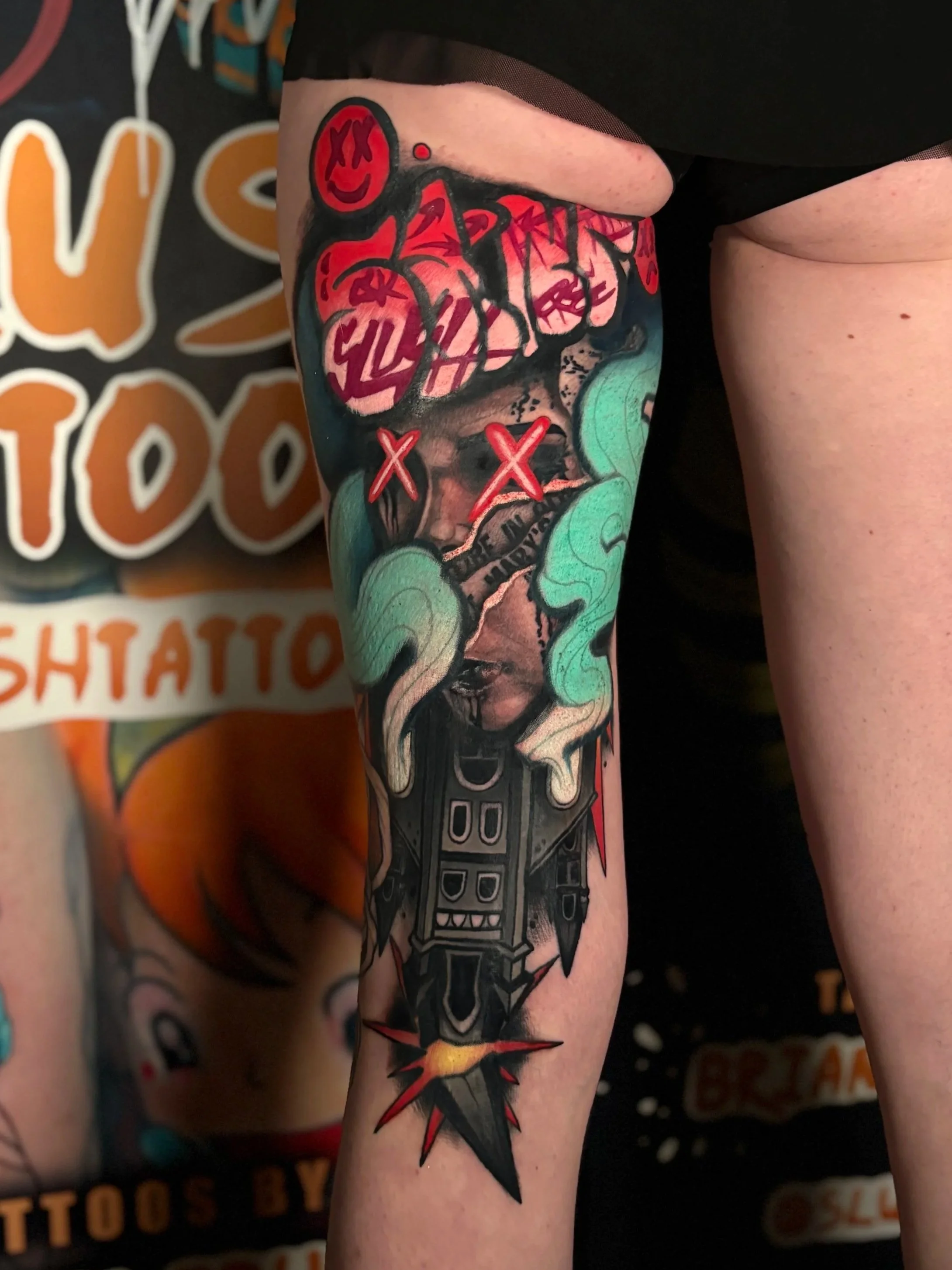 Surreal color collage leg tattoo with portrait and graphic elements by Slush Tattoos