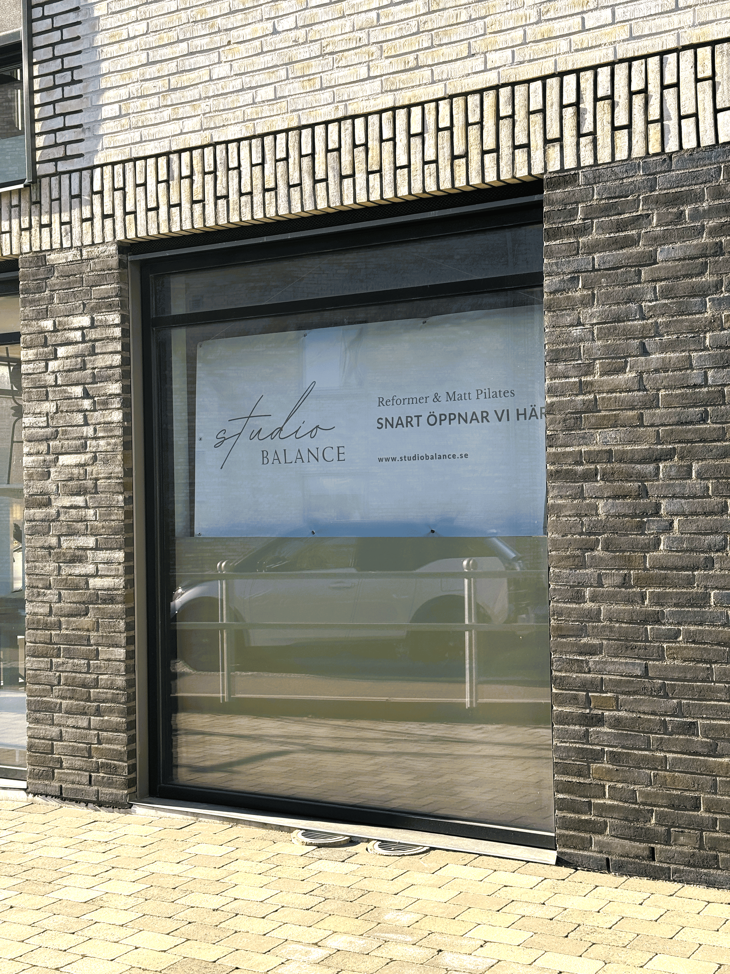 An image of the Studio Balance location with a coming soon banner in the window