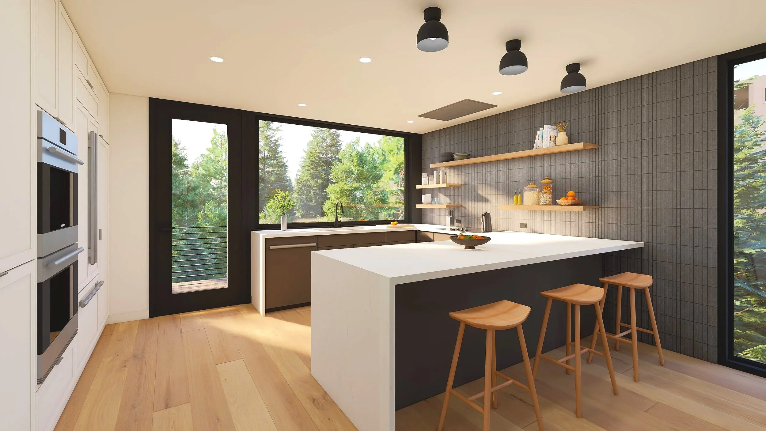 Modern kitchen with white island counter, three wooden stools, gray tiled wall with wooden shelves holding dishes and jars, large window and glass door showing outside greenery, black ceiling lights, light wooden flooring.