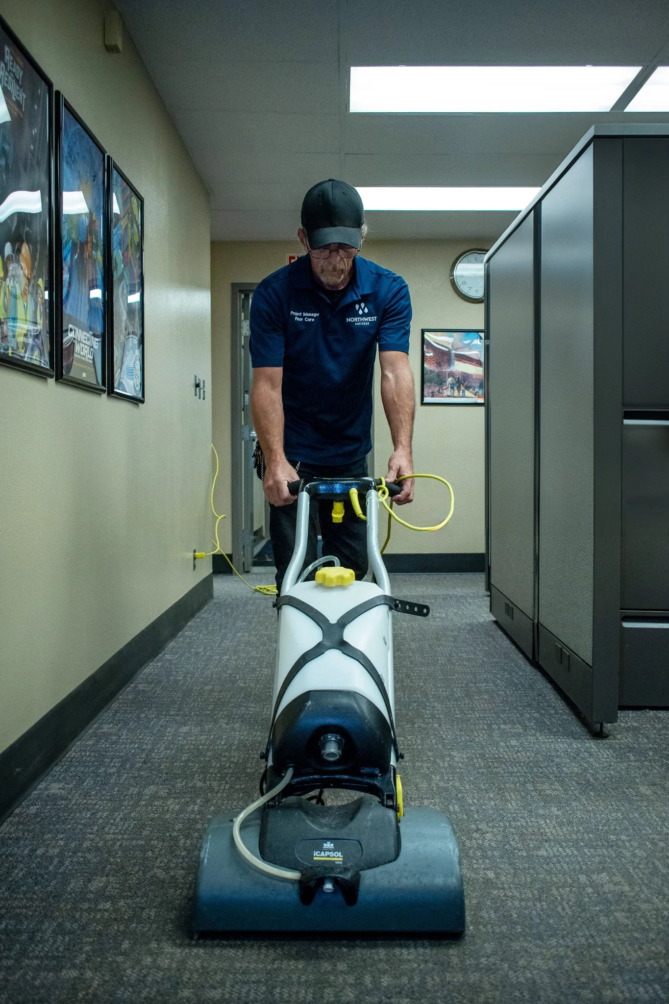 Northwest Success janitor cleaning carpet