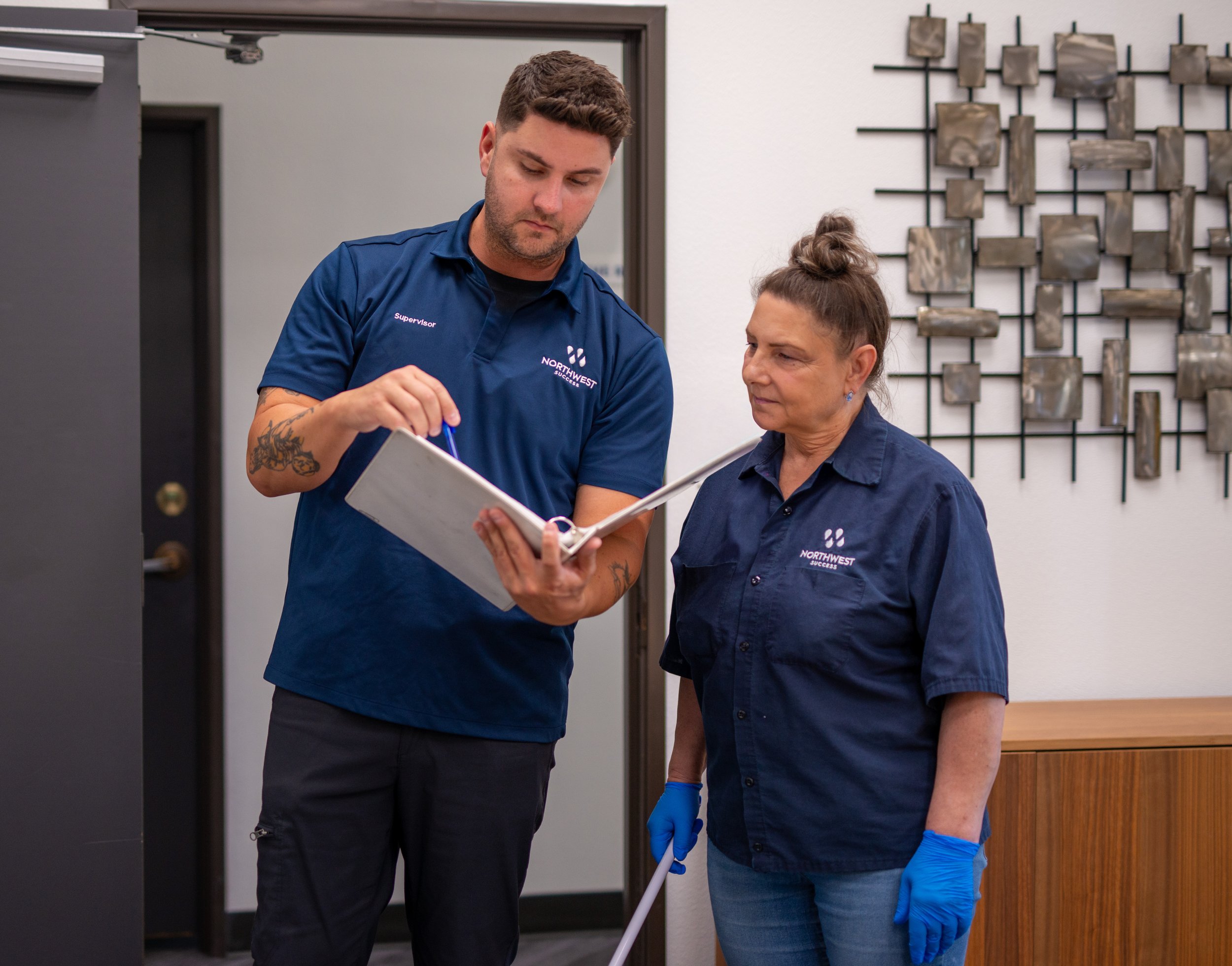 Northwest Success supervisor talking to janitor