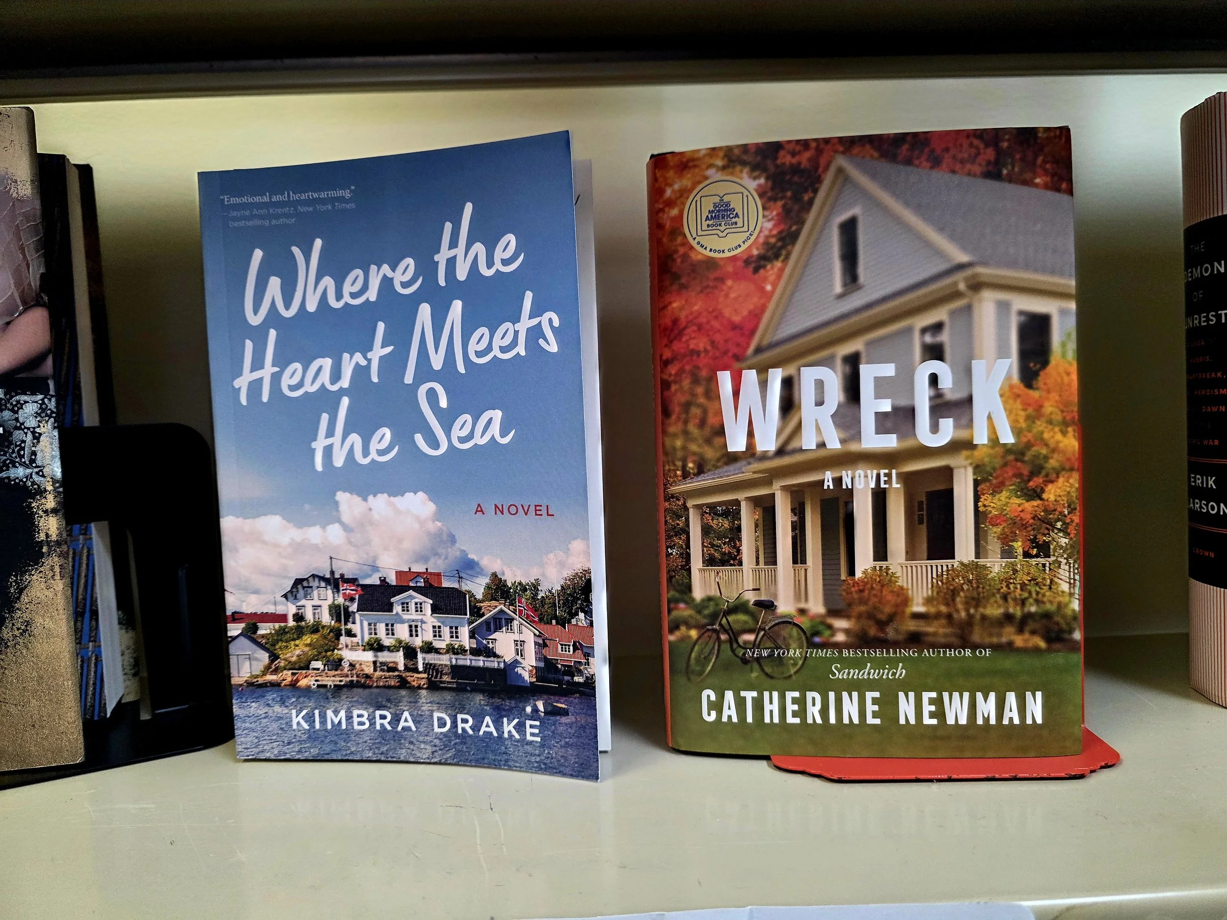 Two books on a shelf, Wreck and Where the Heart Meets the Sea