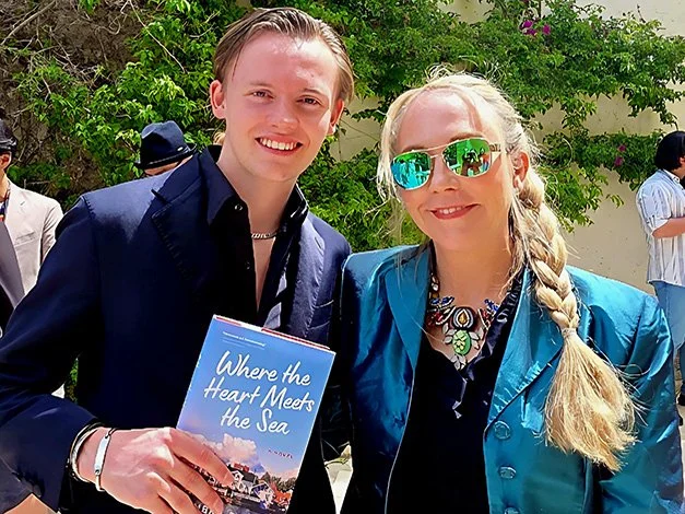 Lukas Wetterberg and Kimbra Drake pose together with Kimbra's book Where The Heart Meets The Sea