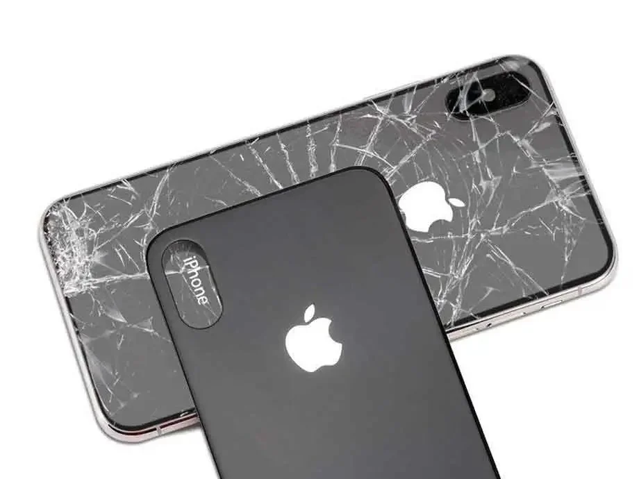 Two iPhones with cracked screens placed on a white background, one showing the back and the other showing the front.