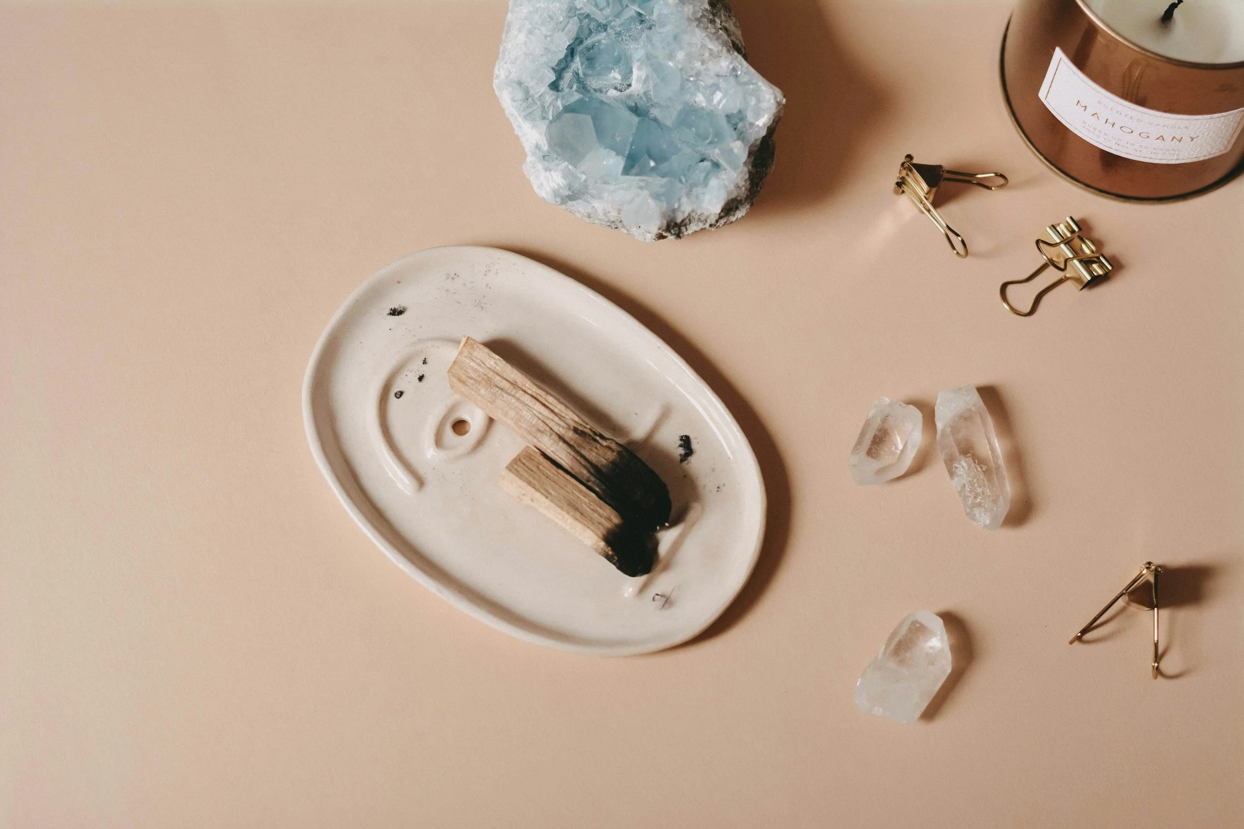 crystals, sage and palo santo representing a science meets soul approach to identity and alignment coaching for women