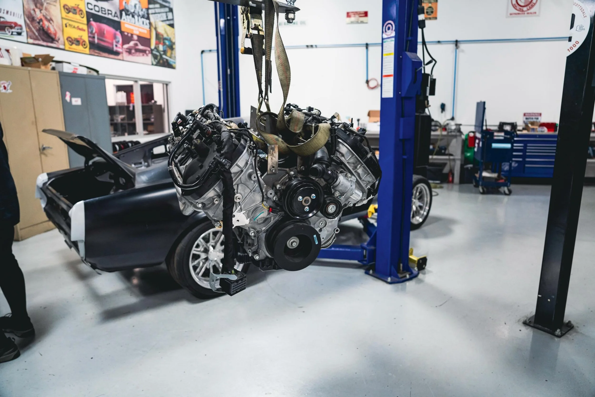 Into the Belly of the Beast. Engine dropped into our newest project! 

@roadstershop 
@fordracing 

#ford #shelby #roadstershop #V8 #restomod