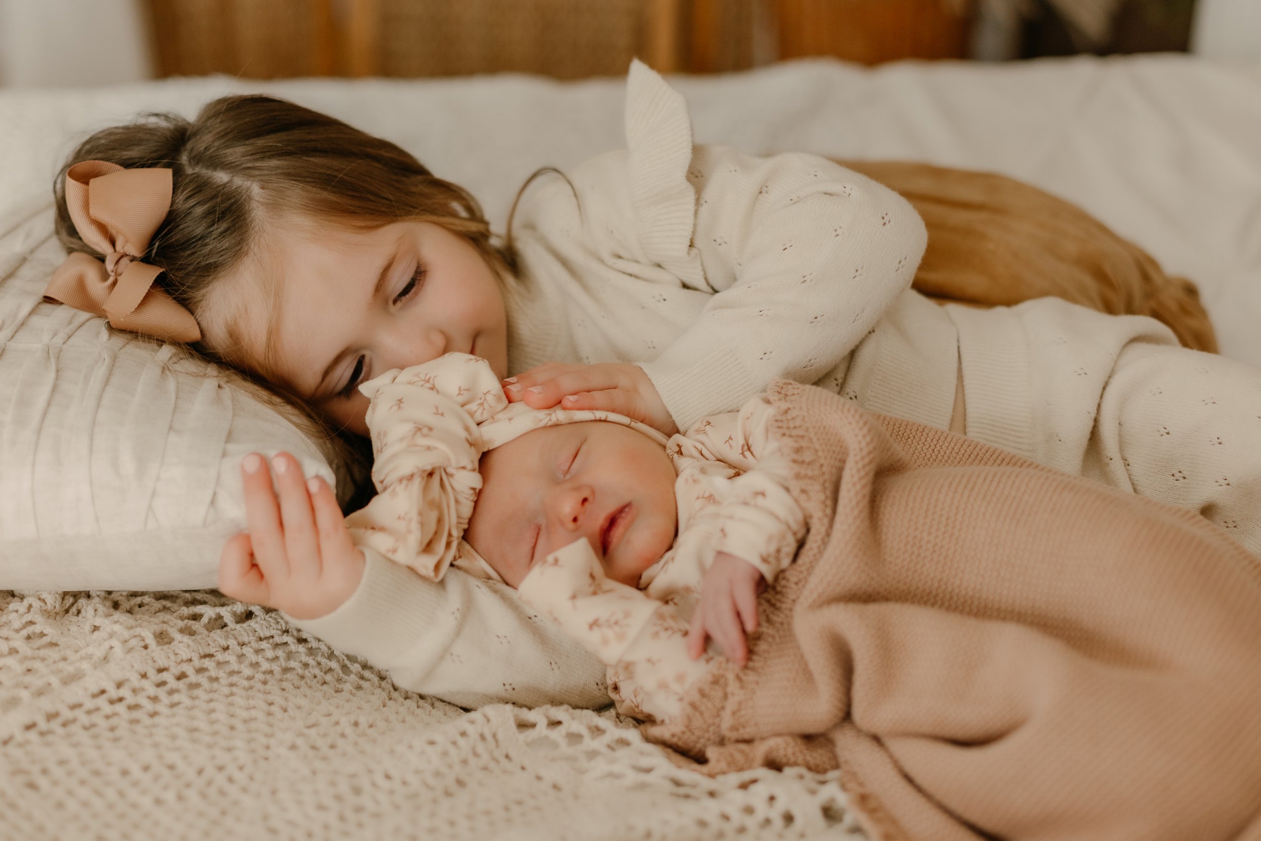 Gentle hands from big sis. 