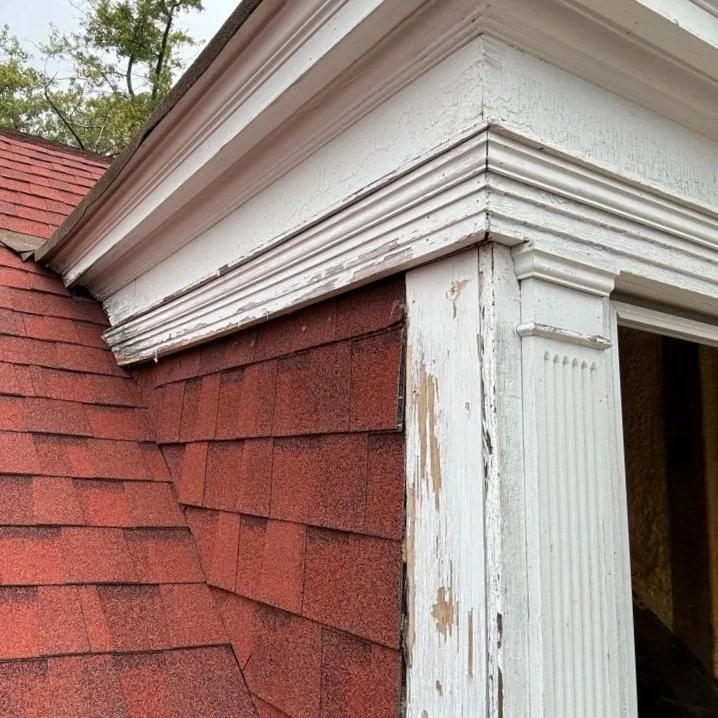 Gable's fascia (exterior trim boards facing outward) was in considerable disrepair on all three sides.  Gable cheeks were clad in unsupported asphalt roofing shingles.  