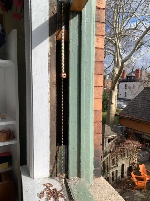 After freeing and removing the sashes, the frames were dismantled, and the weights were restrung.  After cleaning up crusty paint, and adjusting the weatherstripping, the sashes and frames were reassembled.  Seams were caulked, channels were waxed, a