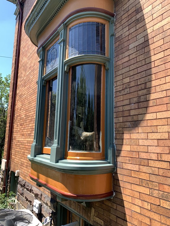 After replacing the missing pieces, the joints were resealed, glazing was touched-up, and everything was sealed in enamel primer, and repainted twice.