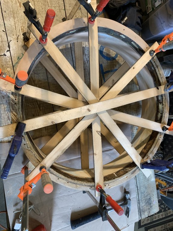 The pieces of frame were stripped. New pieces were fabricated out of spanish cedar to replaced those that were ruined/missing.  The frame was reconstructed, clamped and re-glued.  Once rebuilt, it was finely sanded,  primed, and repainted twice.