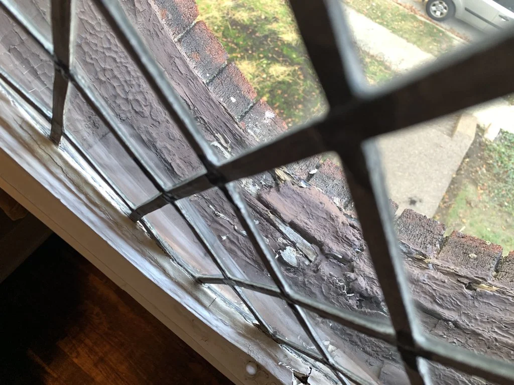 The cut glass pane is also in great need of repair.  The joints and solder of the came (lattice) stretches and weathers, becoming loose and brittle.