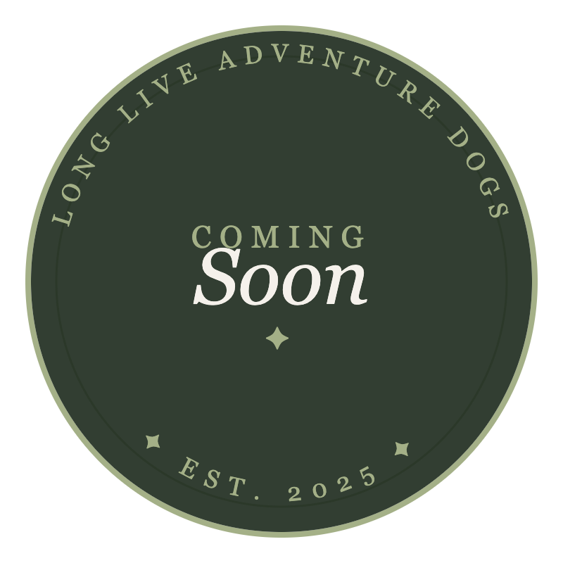 Circular logo with a dark green background and light green border, featuring the text 'Long Live Adventure Dogs' around the top edge and 'Est. 2025' at the bottom, with the central text 'Coming Soon' in light and bold font.