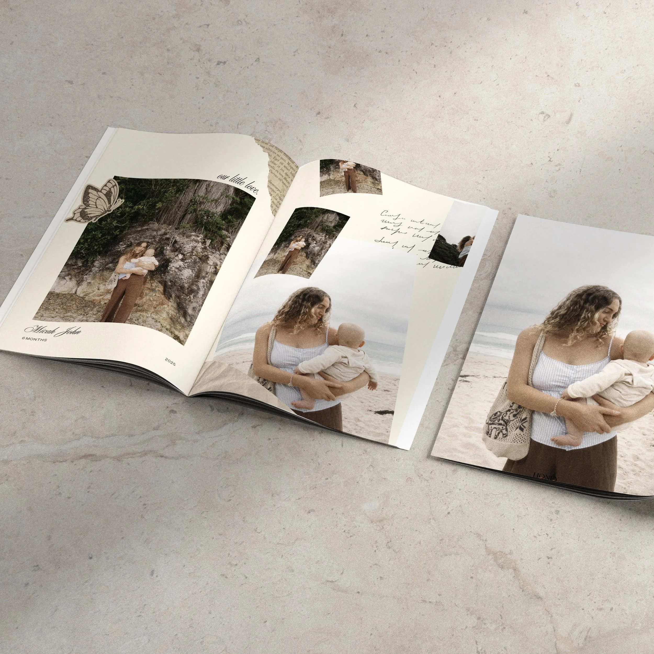 Open photo album displaying pictures of a woman holding a baby at the beach and outdoors, with some decorative butterfly stickers and handwritten notes.