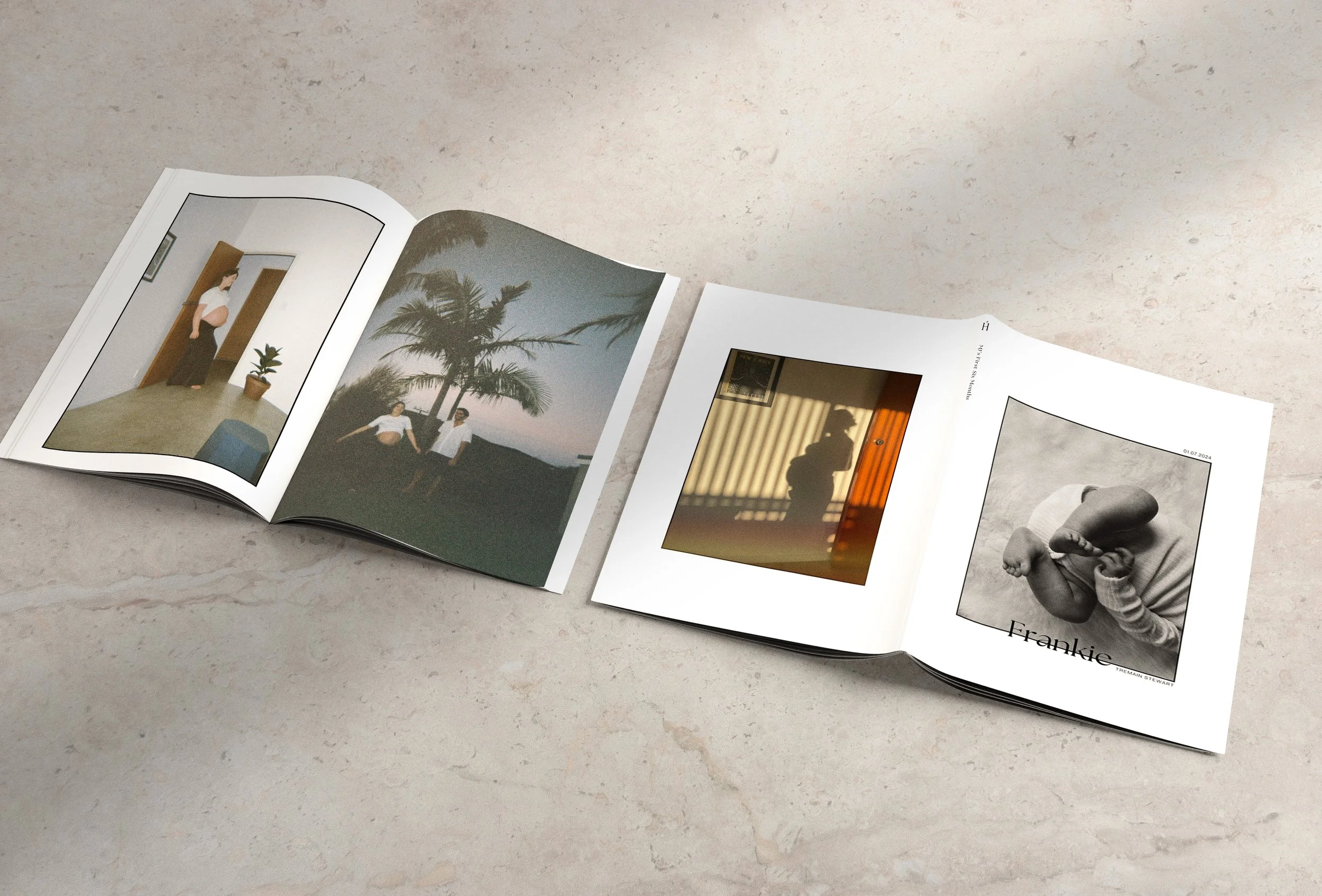 An open photo album on a light-colored surface, displaying two pages with photographs. The left page has a parked woman and a man near palm trees at sunset. The right page has a silhouette of a person behind blinds and a black-and-white photo of a ba