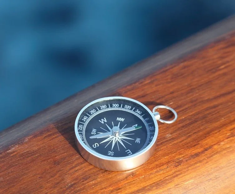 Compass pointing north, representing actuarial direction, structured evaluation, and informed decision-making.