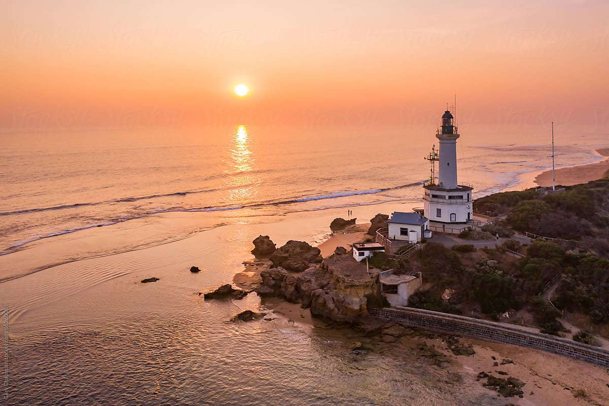 Sun rising behind suspension bridge representing how Ordinance brings clarity to complex reinsurance pricing models.