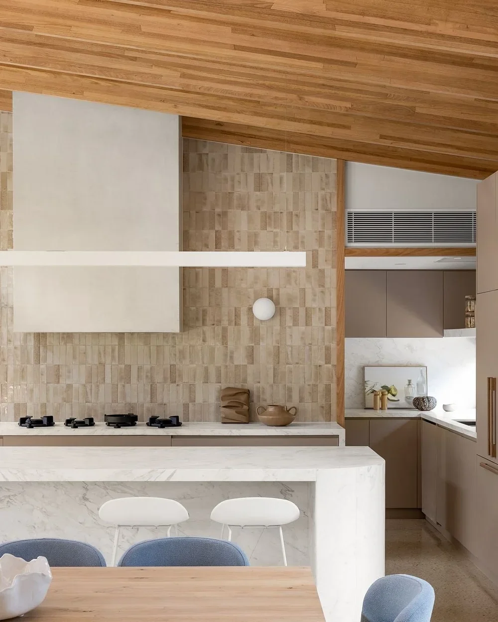 Modern microcement custom range hood / vent hood perfect for a coastal kitchen remodel.