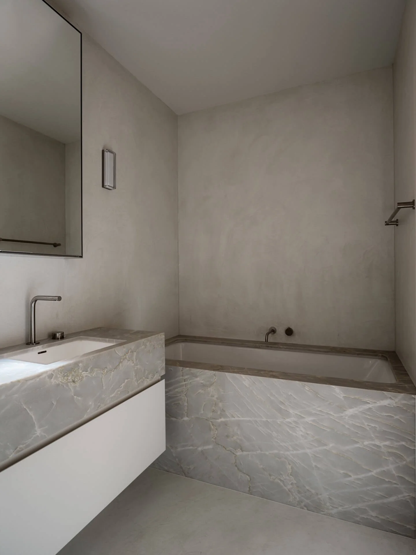 Minimalist bathroom with custom microcement bathtub, vanity, floors, walls, and ceilings all seamless, no grout.
