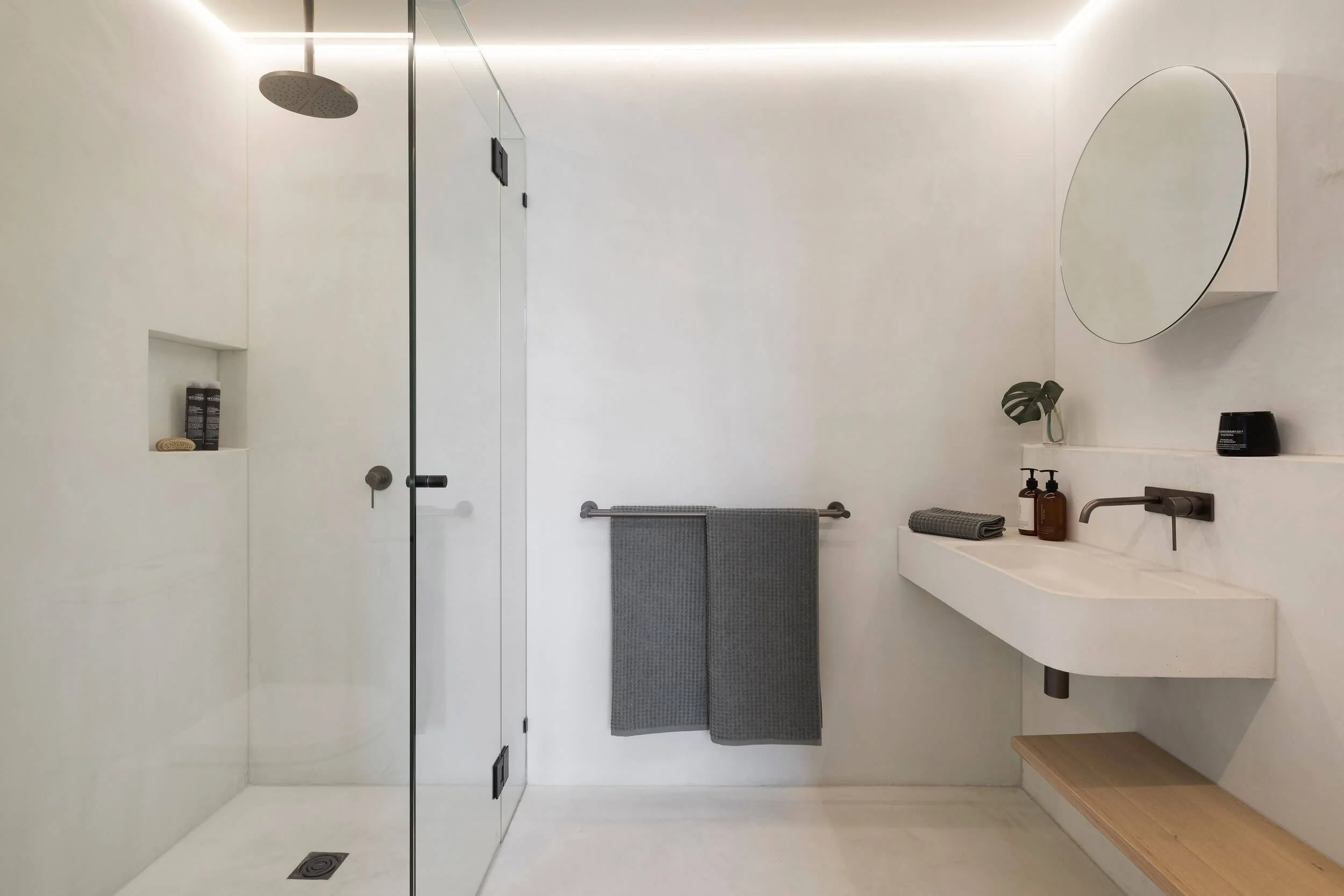 Seamless, white microcement wet room / bathroom perfect for your next bathroom remodel.