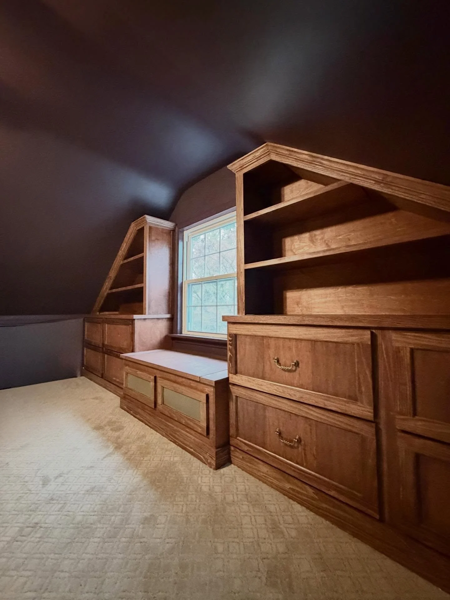 The beauty is in the grain! 

Added some beautiful storage to the third floor nook of this house. 
.
.
.
.
.
.
.
.
.
.
.
#customcabinetry #builtin #woodworking #redoak #poplar
.
.
Custom cabinetry and staining by Two Hounds Woodworking