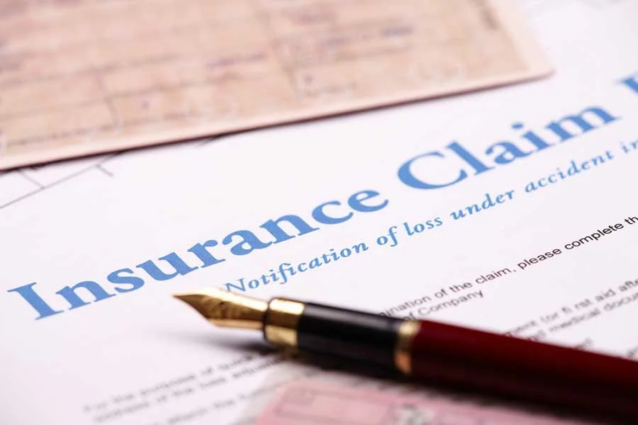 Insurance Claim Form with Pen