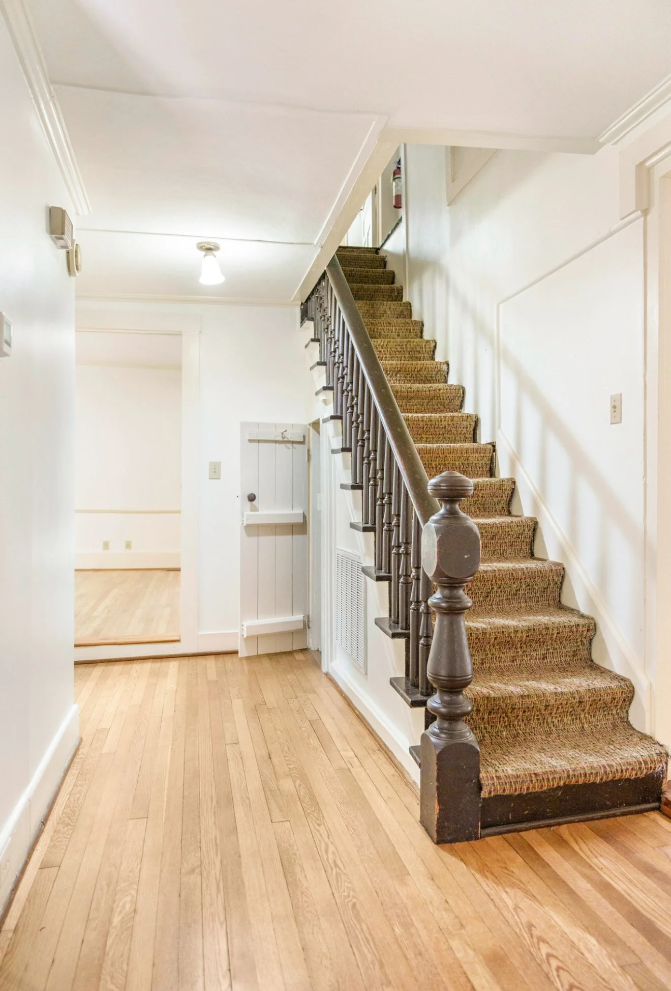The Historic stairway of the Captain J. F. Alston House in Pittsboro, the home of Gandy Coffee and Purrsuasion Cat Cafe