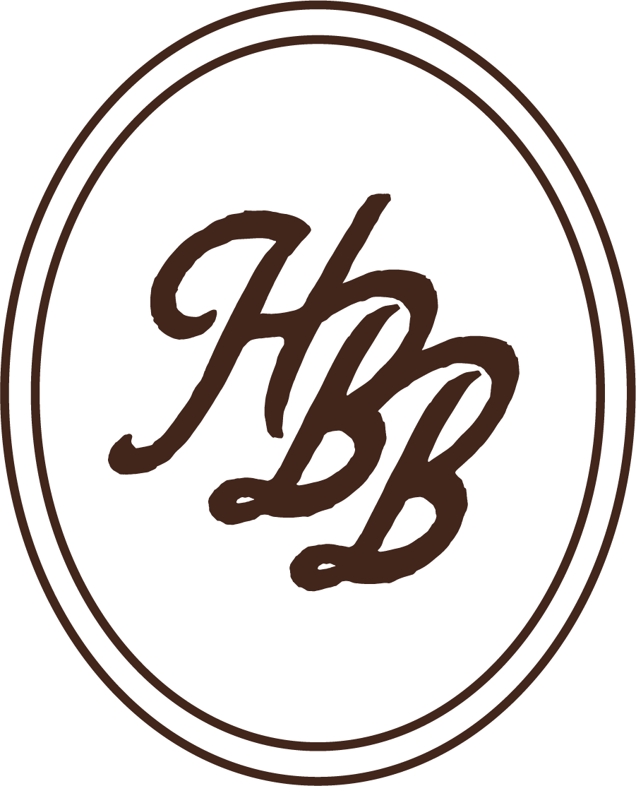 A dark logo with the initials 'HBB' in brown, stylized cursive font inside an oval outline.