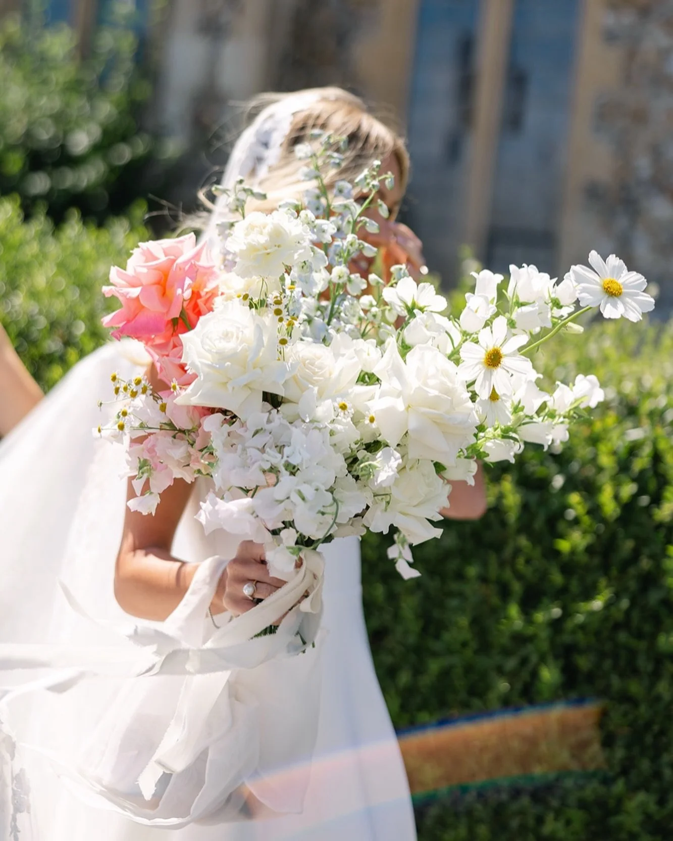 And now a moment for Malak&rsquo;s other showstopper of a bridal bouquet ✨ 

Soft whites &amp; subtle pops of colour, tied simply with trailing silk ribbon. Ruffled textures, hero blooms &amp; frilly details. Love. Love. Love. 
.
.
.
Malak &amp; Mike