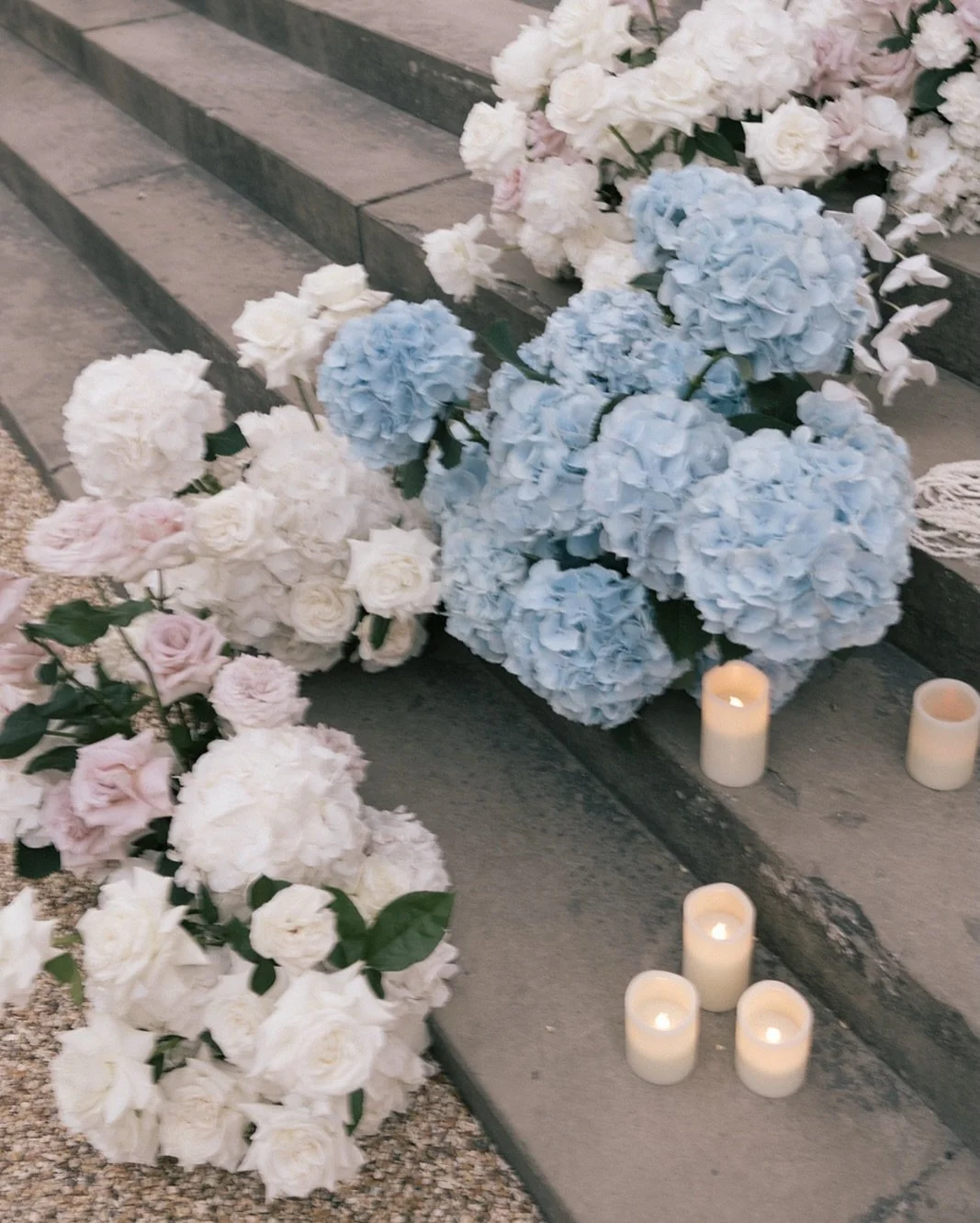 Soft, fluid compositions, designed to move gently through the space. Flower heavy-designs, guided by a sense of balance and an emphasis on show-stopping abundance &amp; quiet restraint. 

The soft whites and pale blush tones, with considered moments 