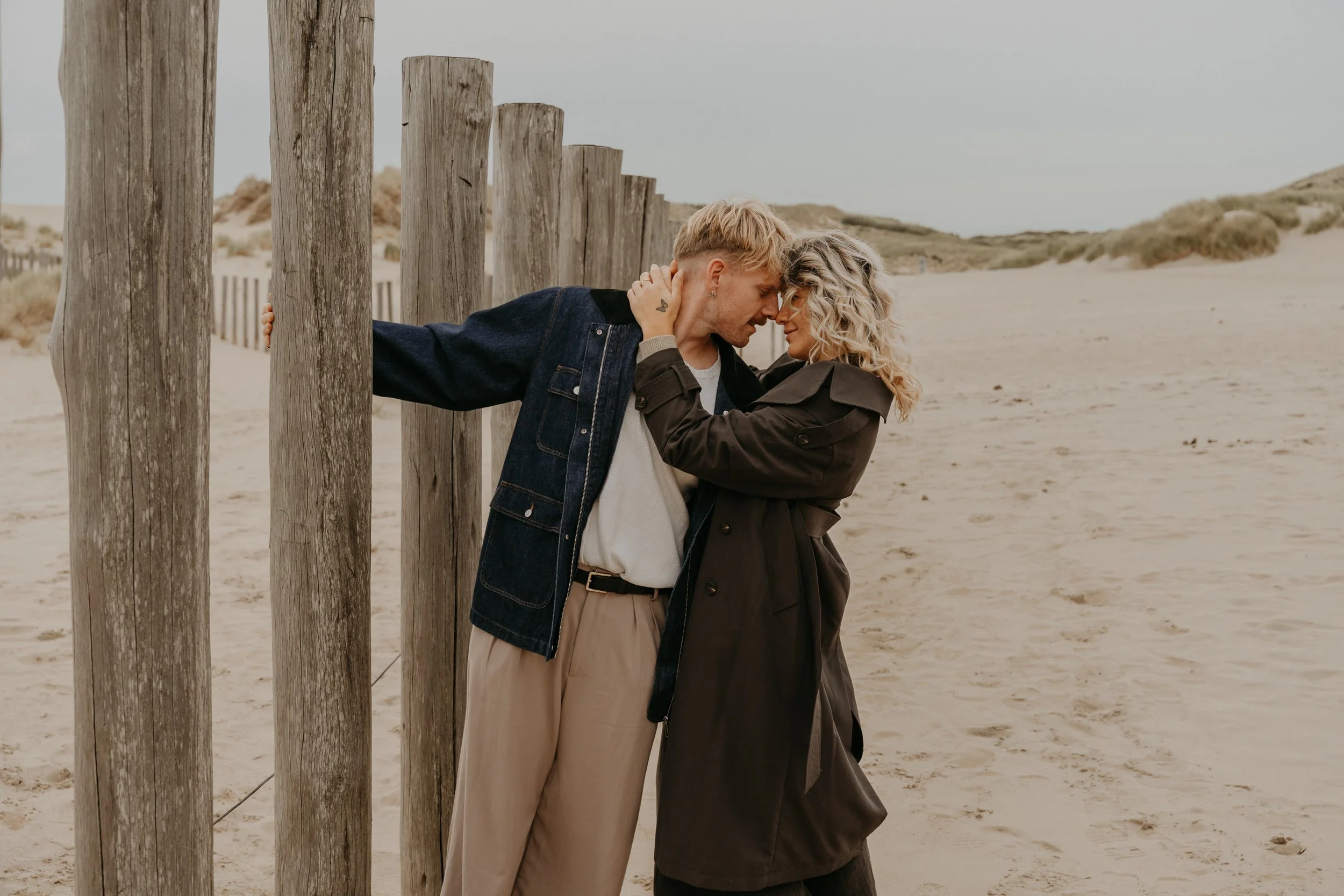 Couple Photography Netherlands – candid love moments by the ocean.