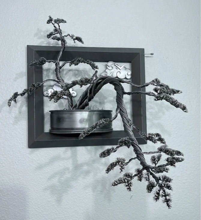 "Contentment", 2025, Steel+Marble Chips+CC, 15"Hx15"Wx12"D. Wall hanging sculpture. Kinetic aspect. Available - email for info.
