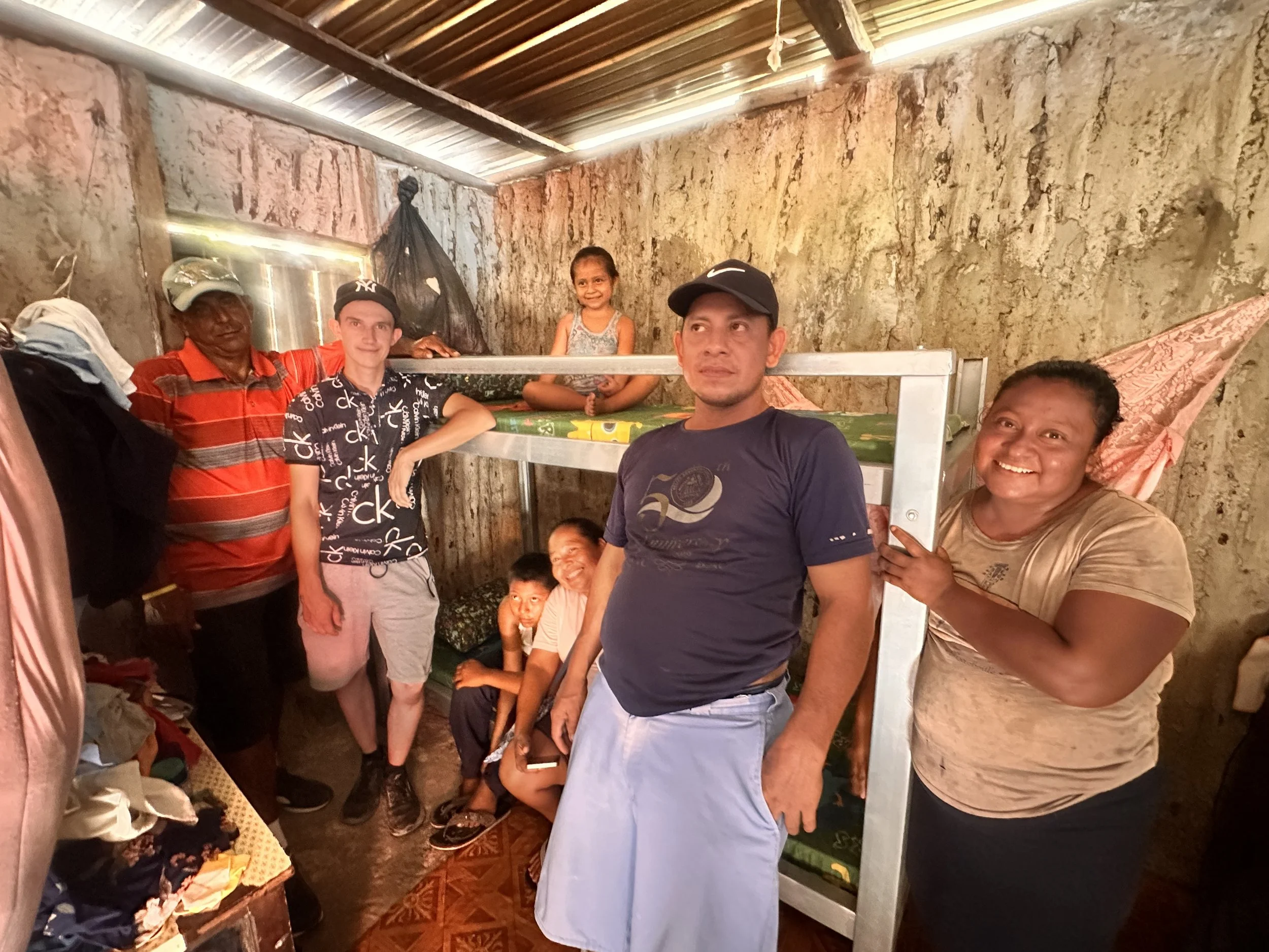 True Belize volunteers delivering a handmade bunk bed to a family in Caledonia Village, Belize as part of our Christian community assistance ministry.
