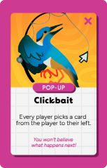 Card from a game called Clickbait featuring a blue bird with an orange beak, set against an orange background. The card has a pink banner with 'POP-UP' and the title 'Clickbait.' The bottom text reads, 'Every player picks a card from the player to their left,' and a quote says, 'You won't believe what happens next!'