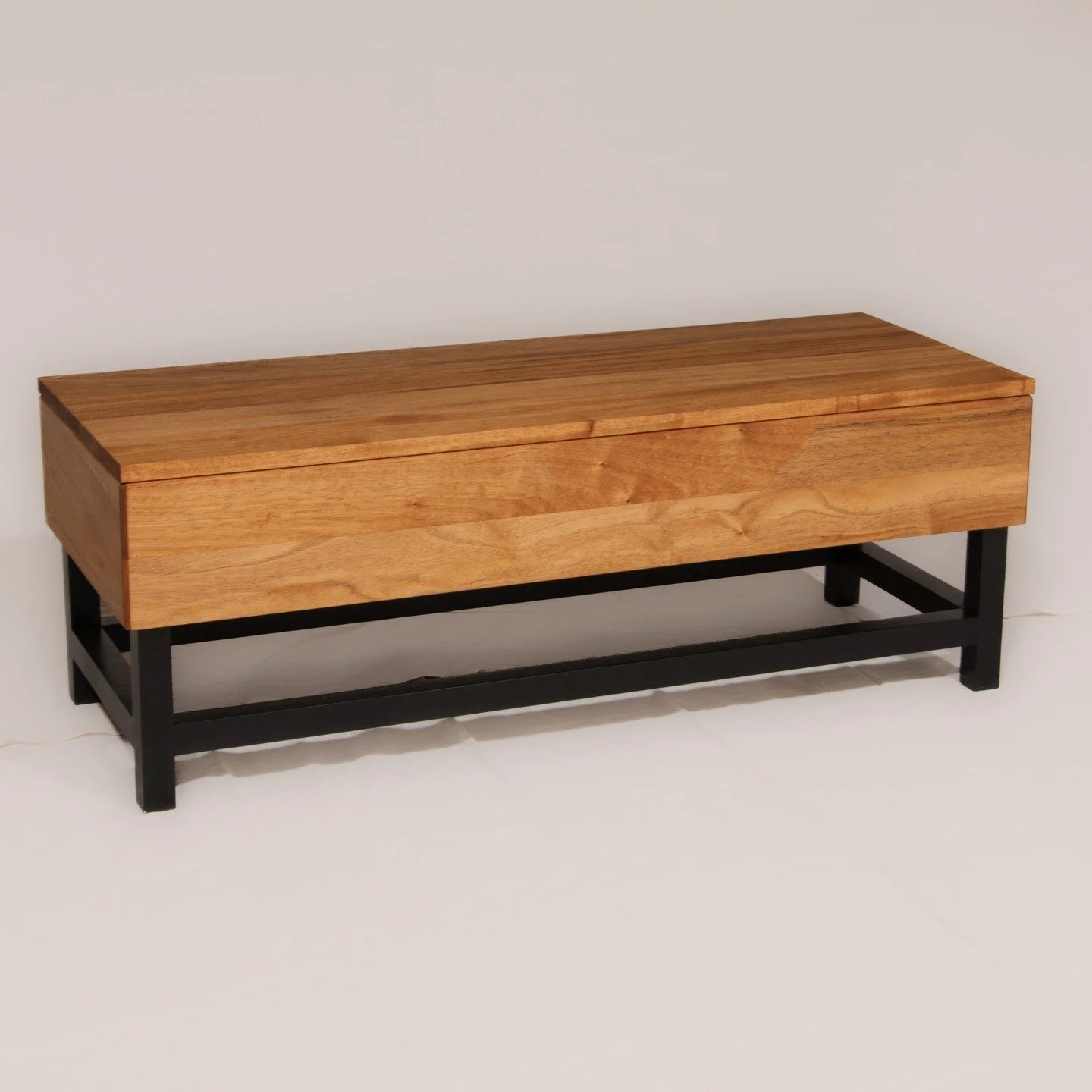 Another Client's table finished! This piece was designed to to match an existing room's aesthetic choice of simple black lines supporting a solid wooden top. Within the room, the African Mahogany top, with it's alternate grain growth directions and v