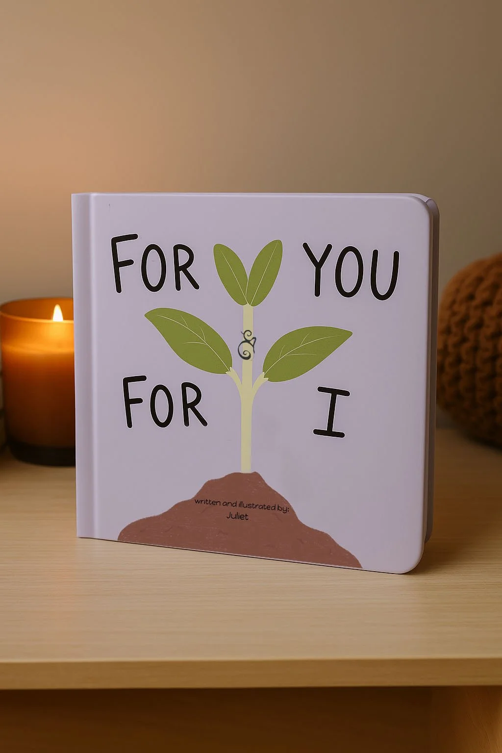 For You & For I children's board book displayed on a clean desk with candle - soft, minimalist lifestyle photo by Juliet