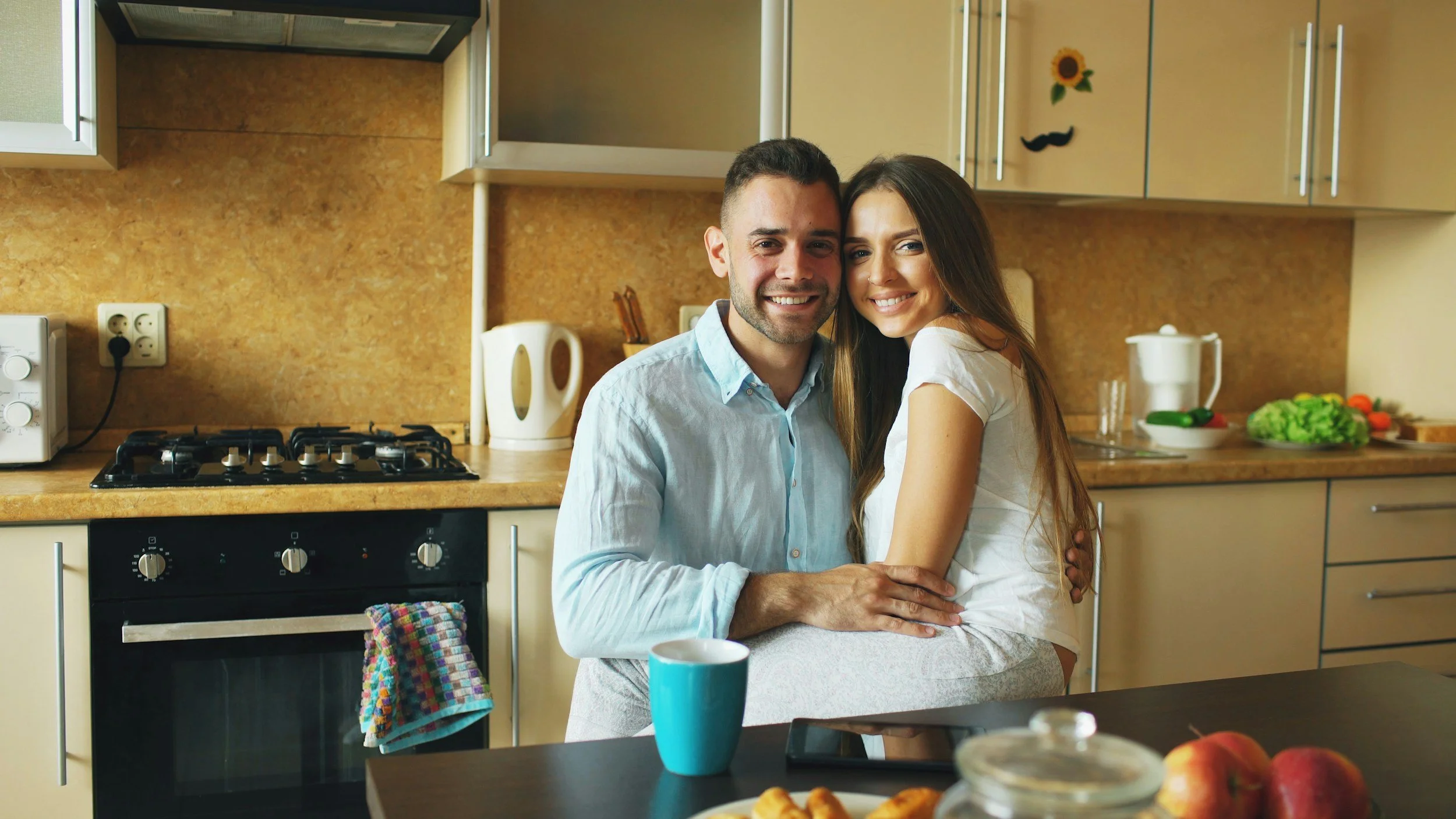 Picture of young couple in kitchen