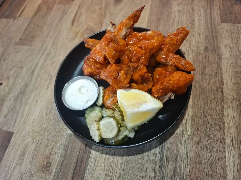 Wings with lemon and pickles at Good Sport