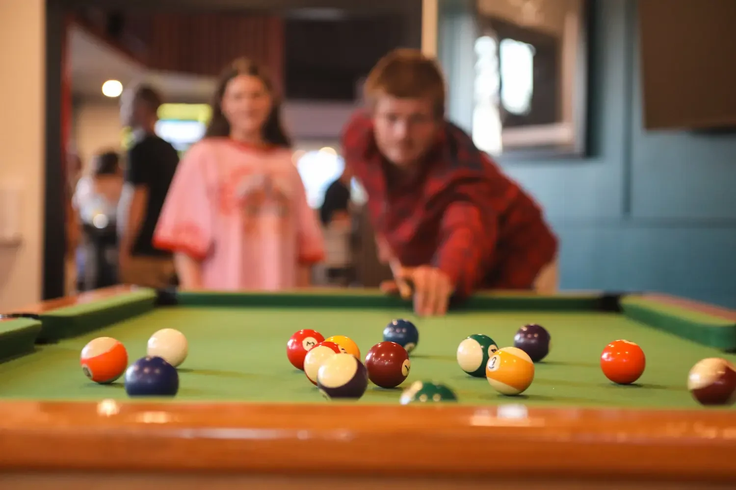Couple playing pool at Napier sports bar