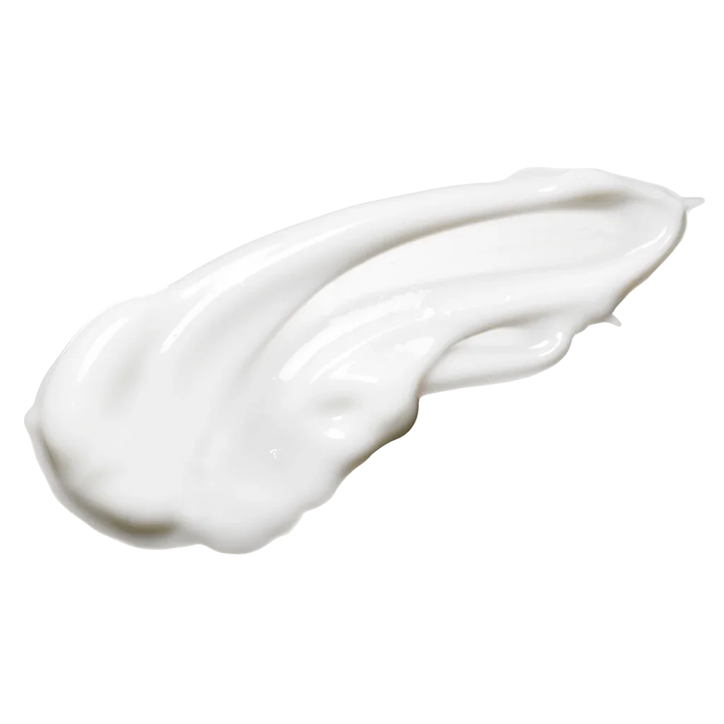 A dollop of white cream or lotion spread on a surface.