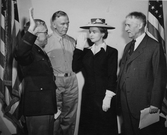 Oveta Culp Hobby is sworn in as the first director of the Women's Army Corps by Major General Myron C. Cramer, Army Judge Advocate General, on May 16, 1942.