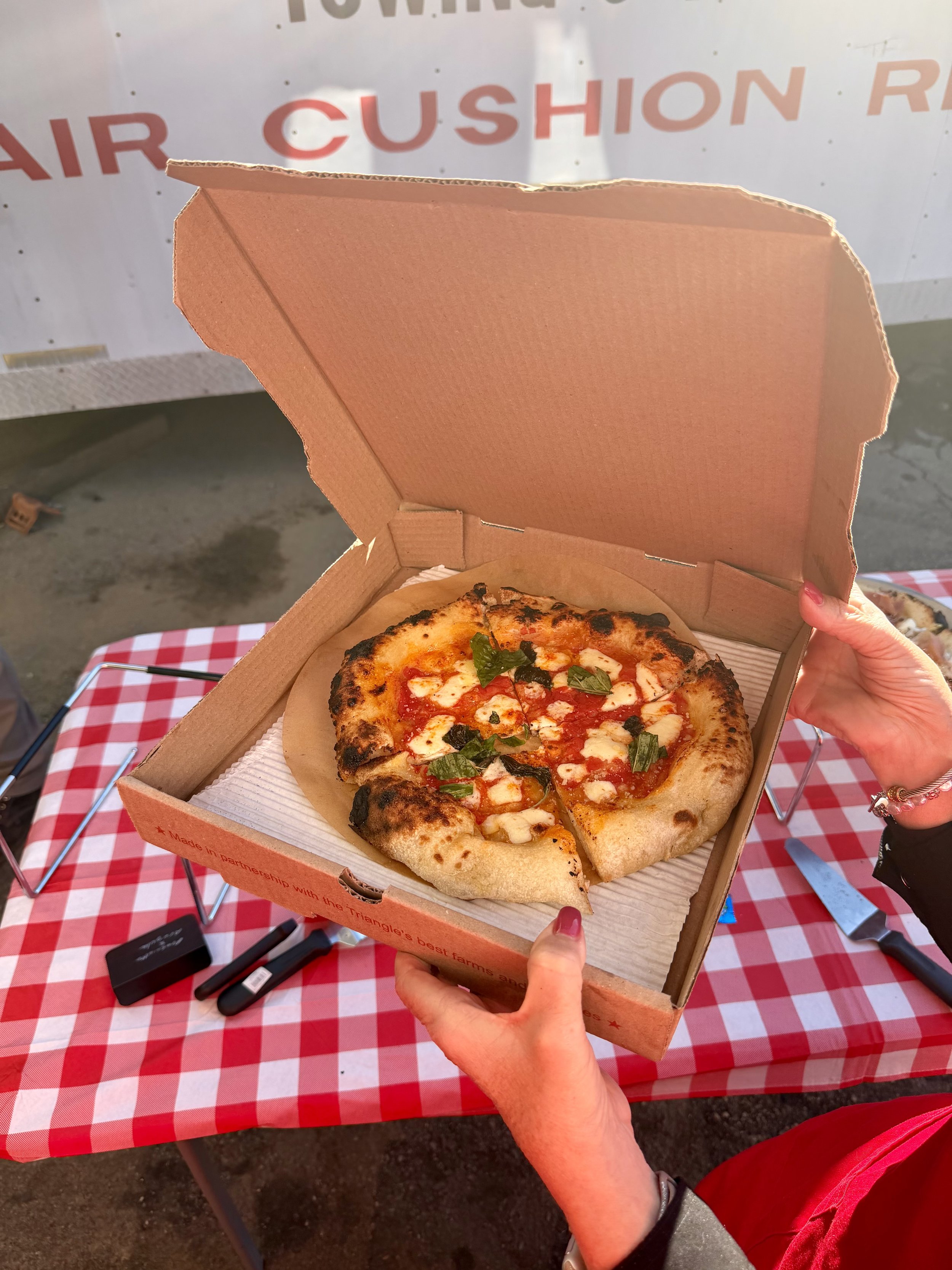 A Margherita pizza by Soci pizza at a catering event in Raleigh, NC.