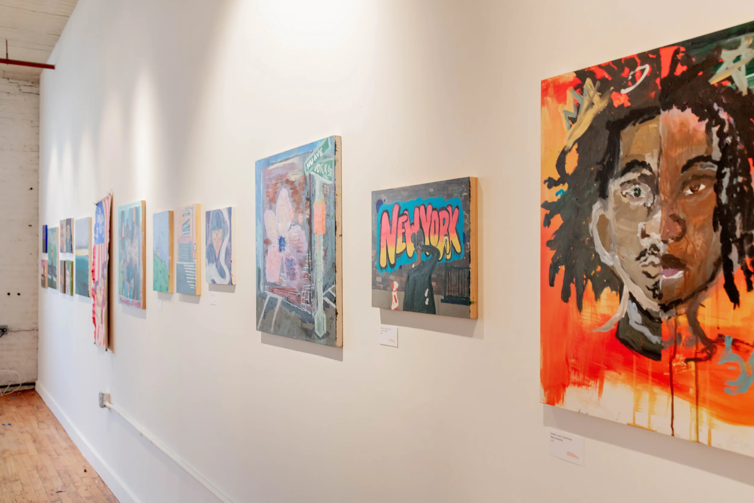 Image of art gallery wall. Photo credit: Artists for Humanity.