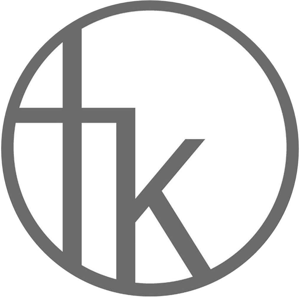 TK Interior circular logo with stylized lowercase “t” and “k” in a minimalist gray design.